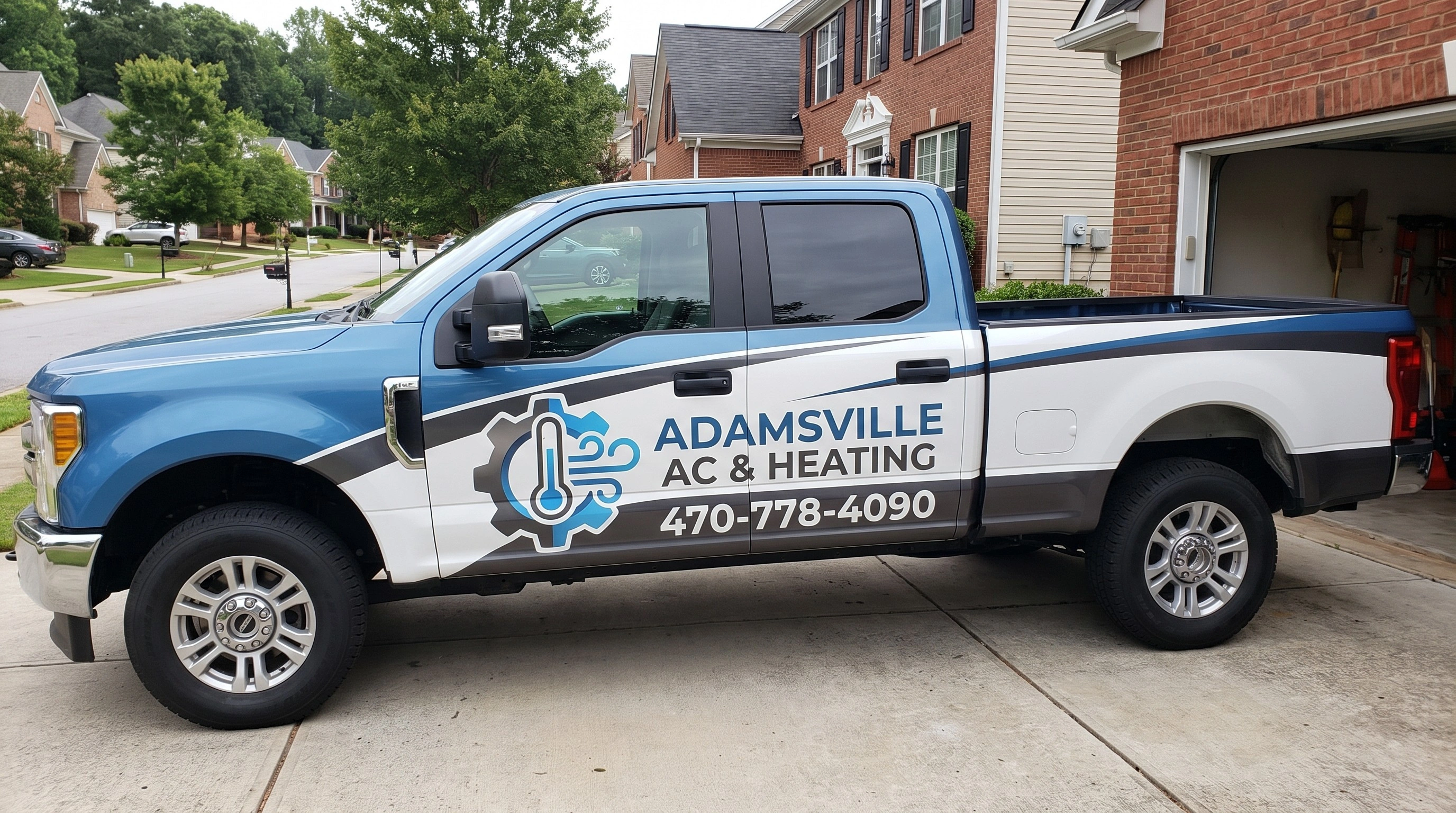 Adamsville AC & Heating technician servicing an HVAC unit in Atlanta, GA